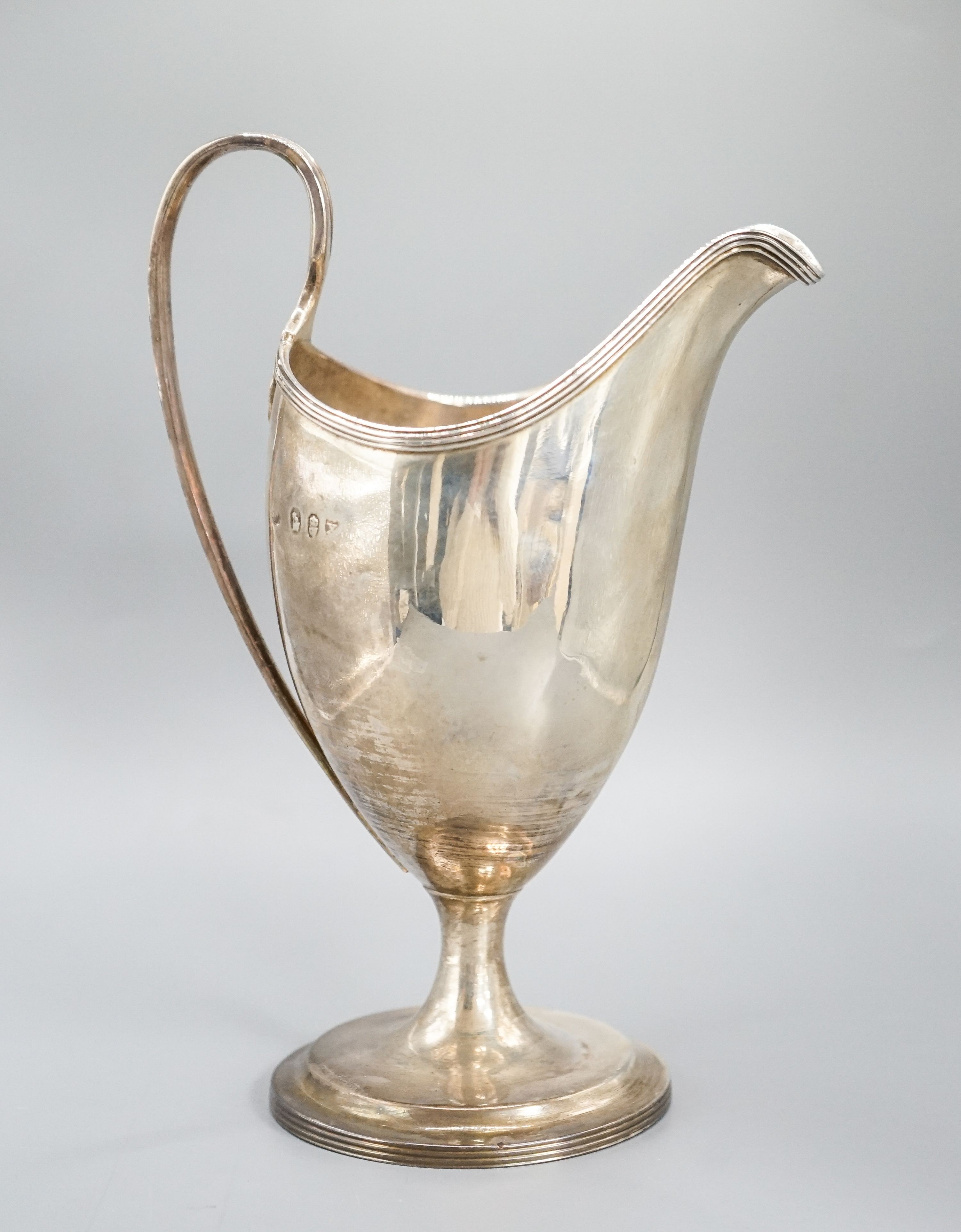 A George III Irish silver pedestal cream jug, George West, Dublin, 1794, 18cm, 7oz.